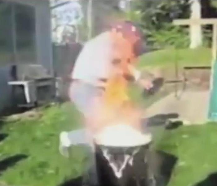 Video still of a turkey fryer on fire